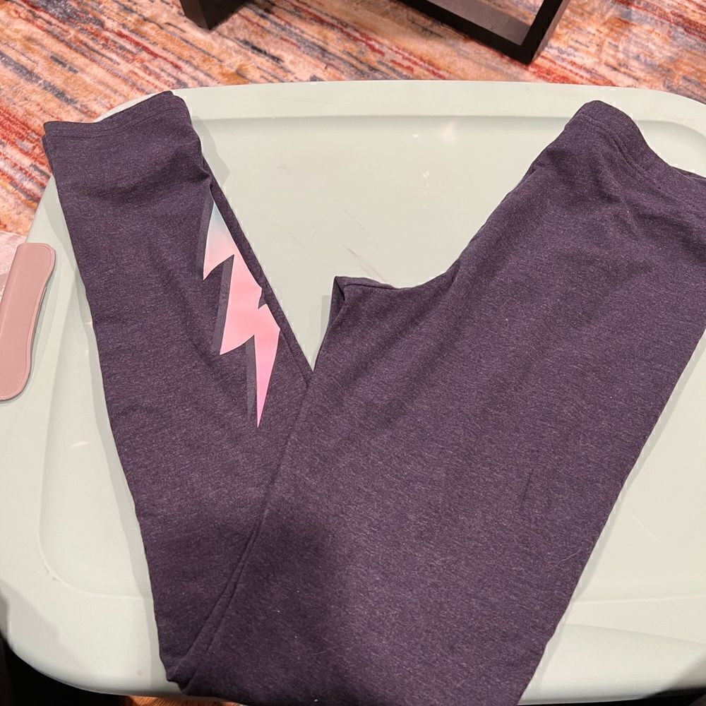 Girl’s Old Navy Built-In Tough leggings with lightning strike appliqué on leg